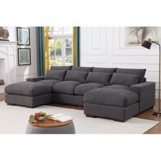 a living room with a large gray sectional couch