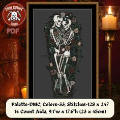 a cross stitch pattern with two skeletons and roses in the frame, next to a lit candle