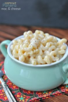 a bowl of macaroni and cheese on a place mat