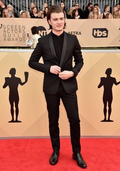 a young man in a tuxedo and bow tie at the sag awards