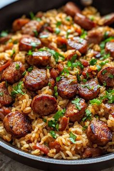 sausage and rice in a skillet with parsley garnish on the side