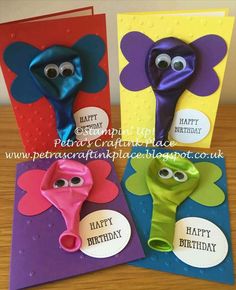 three different colored greeting cards with googly eyes and flowers on them, one has a happy birthday card