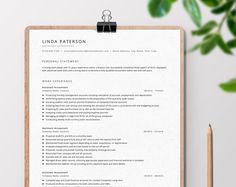 a clean and professional resume is displayed on a clipboard next to a cup of coffee