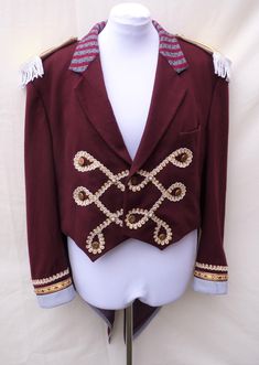 "Mens Extra large  , Upcycled red ringmaster , greatest showman tailcoat . Would fit a women size UK 24  ,US 20 Made from a mens ' Next  ' red woollen jacket. It also has gold Braid and gold buttons.  Measures chest 129 cm ( 50.5 \") Waist 124 cm (49 \") shoulder to hem front 57 cm full length back 107 cm sleeve length 65.5 cm top sleeve width 22.5 cm shoulder seam 16.5 cm across front 48 cm (across back 51 cm ) all the way around armhole 64 cm  Can post quickly if needed by a certain date. Need Black Ringmaster Jacket, Circus Jacket, Zatanna Cosplay, Steampunk Festival, Gothic Jackets, Wool Wash, Circus Theme, Circus Party, Dress Out