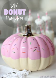 diy donut pumpkin with pink frosting and sprinkles on it