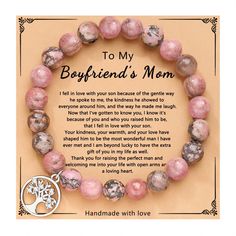 a pink beaded bracelet with a tree charm on it and a poem written in the middle