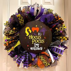 a halloween wreath that says it's hocus pocus time witches on the front door