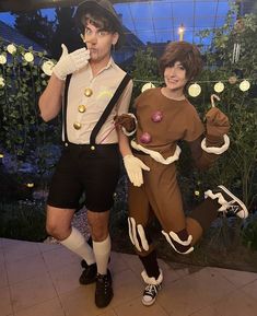 two people in costumes standing next to each other