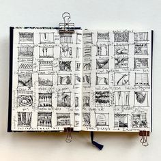 an open notebook with drawings on it