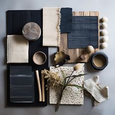 a table topped with lots of different items on top of a white counter next to a plant