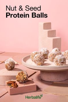 nuts and seed protein balls on a plate with the words nut & seed protein balls