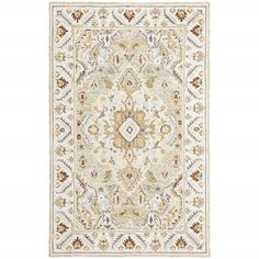 an ivory and gold rug on a white background with floral design in the middle,