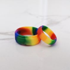 How are Knot Theory Rainbow rings different? Vibrant and non-fading rainbow to brighten up your getup. Twice more rainbow than other rainbow rings, twice more fun! More comfortable than not wearing pants. Durable. Quality construction, high performance. Pinch-free. Callus-free. We take care of your fit so you can fully experience your Knot Theory rings. Silicone Ring Women, Rubber Rings Wedding, Silicone Wedding Band, Silicone Wedding Rings, Rave Accessories, Double Rainbow, Silicone Ring, Rainbow Rings, Rubber Rings