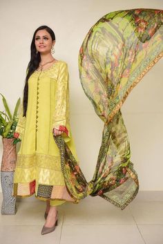 Description An alluring lime ensemble portrays an intricate design at the front and sleeves which is enhanced with pearls & beads handwork. The look is complemented with a gorgeous silk dupatta to adorned this festive season. 3 Piece Size: Medium & Large size available( Size Chart given in the pics) Color: Yellow Family  Shirt Fabric: Crinkle Chiffon  Dupatta: Silk Trouser: Rawsilk  Includes: Shirt, Inner, Trouser & Dupatta Please Note: Actual color may slightly vary from the image shown due to Yellow Family, 3 Piece Dress, Beautiful Suit, Chiffon Dupatta, Silk Trousers, Family Shirt, Evening Outfits, Silk Dupatta, Shirt Fabric