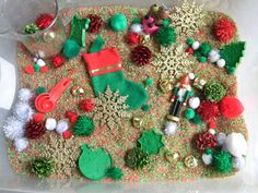 a tray filled with christmas decorations on top of a table