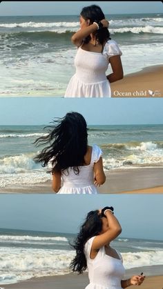 the woman is walking on the beach with her hair blowing in the wind, and she's wearing a white dress