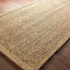 an area rug on the floor with wood floors and hardwooding in front of it