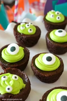 some cupcakes with green frosting and googly eyes