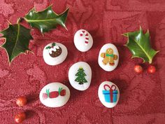 decorated rocks with christmas decorations and holly leaves