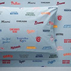 a pillow case with many different types of logos on it and the name of each team