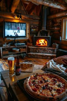 a pizza sitting on top of a wooden table next to a fire in a fireplace