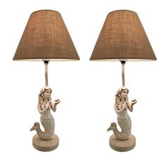 two lamps that have mermaids on them