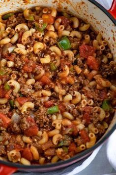 a pot filled with pasta and ground beef