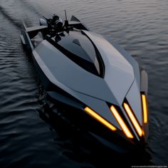 a futuristic looking boat in the middle of water with lights on it's side