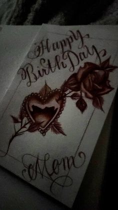 a happy birthday card with roses on the front and back of it, written in cursive writing