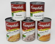 four cans of soup sitting next to each other on a white surface with the word campbell's written in it