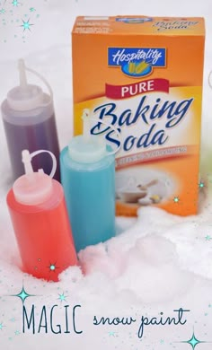 three bottles of baking soda sitting in the snow next to a carton of baking soda