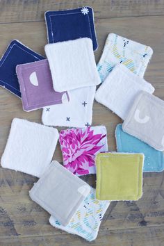 several pieces of cloth sitting on top of a wooden table