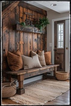 a wooden bench with pillows on it in front of a wall made out of wood planks