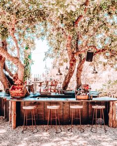 an outdoor bar is set up under the trees