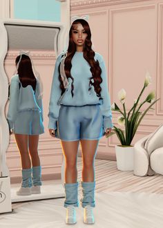 a woman standing in front of a mirror wearing blue clothing and high heeled shoes