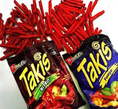 two bags of taks are sitting next to each other on a table with chips