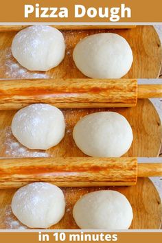 four pizza doughs sitting on top of a wooden cutting board