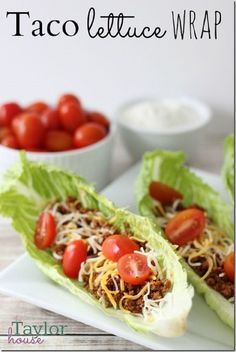 two lettuce wraps filled with tomatoes and sprouts