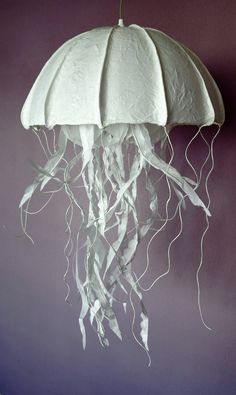 a white jellyfish hanging from the ceiling