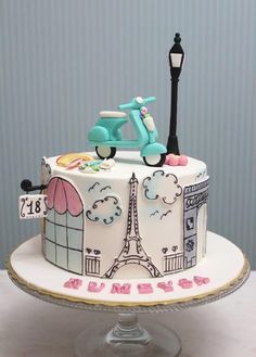 a cake decorated with the eiffel tower and bicycle