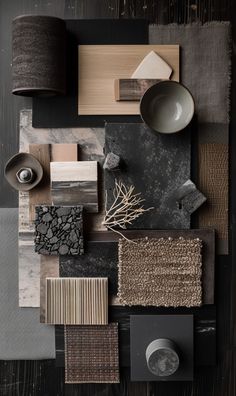 an assortment of different colors and materials are arranged on a table with dark wood flooring