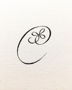 the letter c is drawn in black ink on white paper