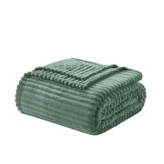 green towels stacked on top of each other