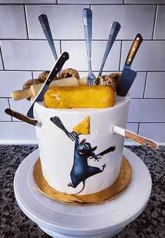 there is a cake with forks and knives on it