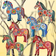 colorful wooden horses are sitting on a tree branch in front of a yellow background with flowers