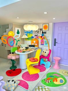 a room filled with lots of colorful furniture and decor