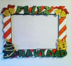 a christmas frame with candy canes and candies on the edges, decorated in green, red, yellow and white