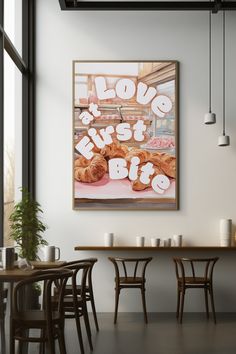 there is a poster on the wall in this dining room that says love just bites