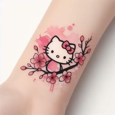 a hello kitty tattoo on the wrist with pink flowers and watercolor paint splatters