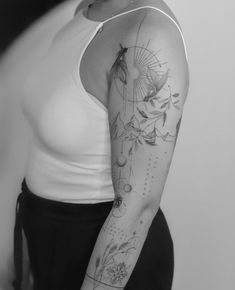 a woman with a tattoo on her arm